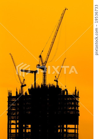 construction cranes and building silhouettes 19536733