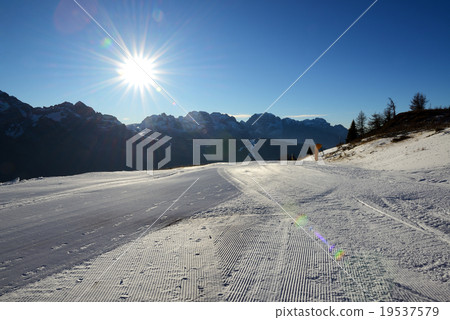 The ski slope with a view on Dolomiti mountains 19537579
