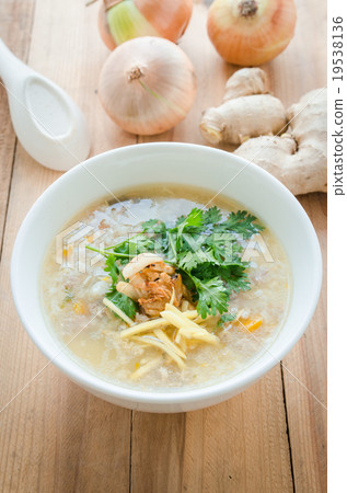 Boiled rice in pork soup with sliced ginger 19538136