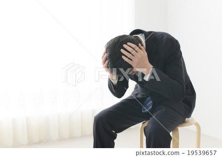 Middle men holding their heads 19539657