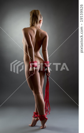 Image of naked girl handcuffed hands and feet Image of naked girl handcuffed hands and feet 19539926