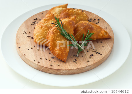 Traditional Cheburek rosemary the wood background 19544612