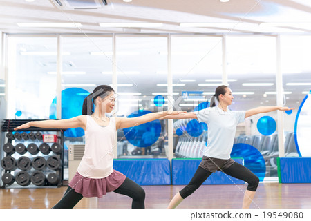 A woman who works for yoga at a sports club A woman who works for yoga at a sports club 19549080