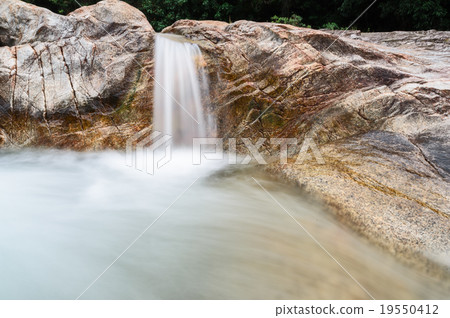 Manora Waterfall and stone in tropical forest Manora Waterfall and stone in tropical forest 19550412