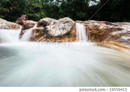 Manora Waterfall and stone in tropical forest Manora Waterfall and stone in tropical forest 19550413