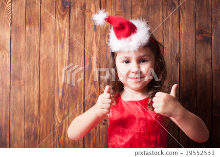 Girl in Santa hat headband Girl in Santa hat headband 19552531