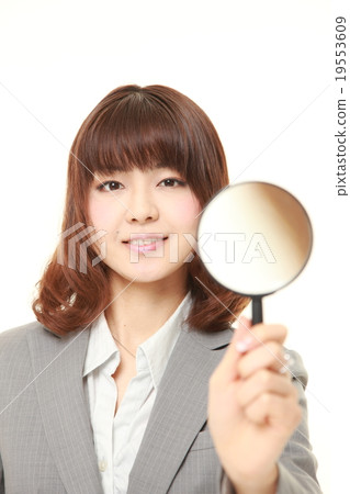 Business woman with loupe 19553609