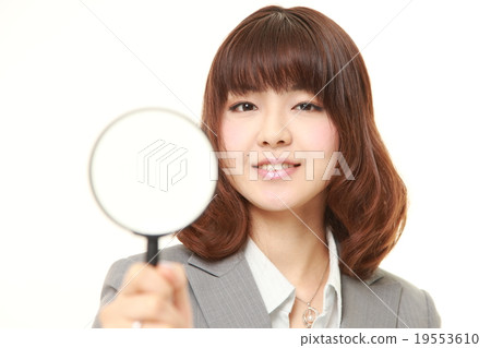Business woman with loupe 19553610
