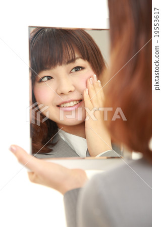 Business woman pleased with beautiful skin effect 19553617