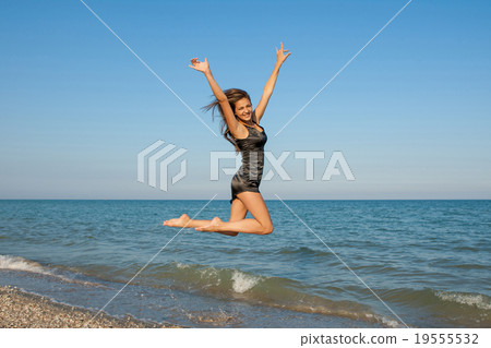 Young cheerful girl on the sea 19555532