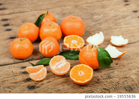 Fresh mandarin oranges on  old wooden table 19555636