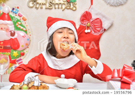 Santa Claus costume girls eating chicken 19556796