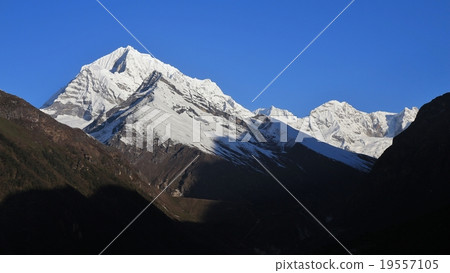 High mountains near Namche Bazaar at sunrise High mountains near Namche Bazaar at sunrise 19557105