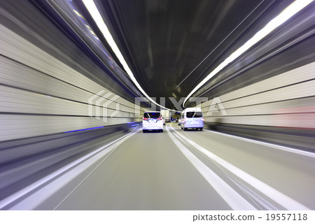 Road Traffic A car traveling on a highway tunnel 19557118