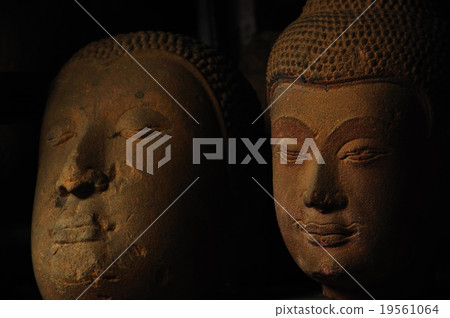 Old neglected sandstone Buddha head 19561064