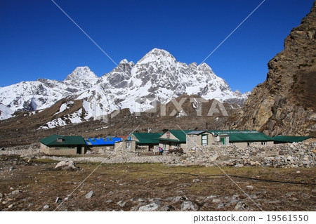 Lodges in Thagnak and snow capped mountain Lodges in Thagnak and snow capped mountain 19561550