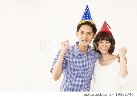 A couple who wears a triangular cap and poses a guts pose A couple who wears a triangular cap and poses a guts pose 19561746