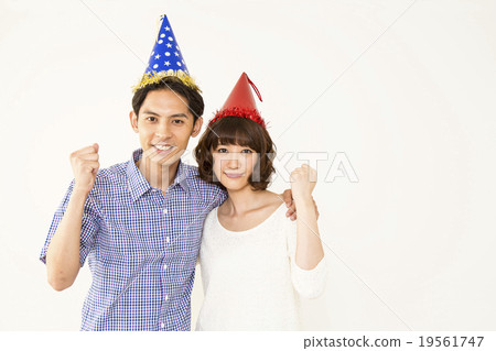 A couple who wears a triangular cap and poses a guts pose A couple who wears a triangular cap and poses a guts pose 19561747