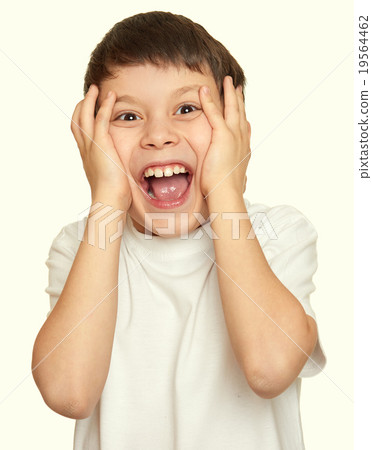 grimacing face boy portrait, teenager closeup 19564462