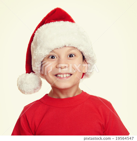 boy in santa helper hat portrait - winter holiday christmas concept boy in santa helper hat portrait - winter holiday christmas concept 19564547
