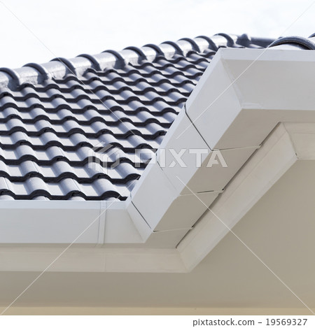 white gutter on the roof top of house white gutter on the roof top of house 19569327