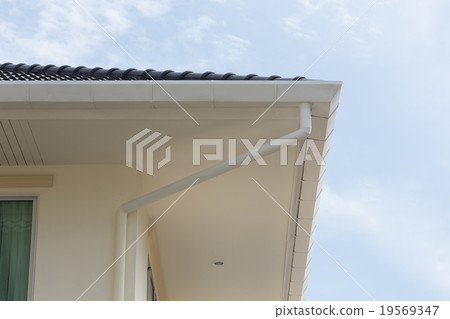 gutter on the roof top of house 19569347