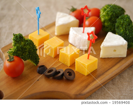 Assortment of Gouda cheese and camembert cheese (sideways position) Assortment of Gouda cheese and camembert cheese (sideways position) 19569408