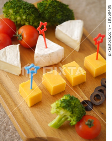 Assortment of Gouda cheese and Camembert cheese Assortment of Gouda cheese and Camembert cheese 19569409