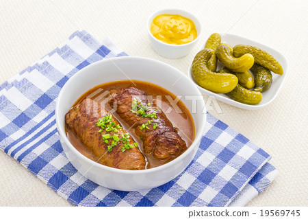 Two roulades beef in bowl with sauce 19569745