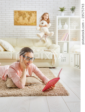 Mother reading a book 19575743