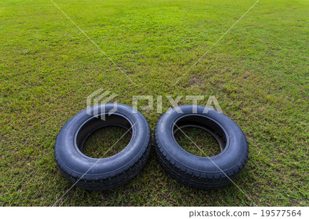 Old tires on the grass Old tires on the grass 19577564