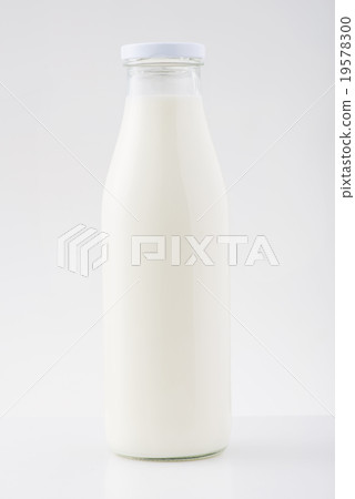 Medium bottle of milk is on the surface. Medium bottle of milk is on the surface. 19578300