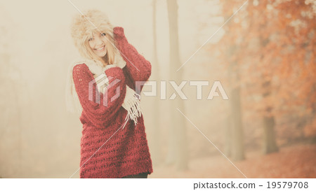 Portrait of pretty smiling woman in fur winter hat Portrait of pretty smiling woman in fur winter hat 19579708