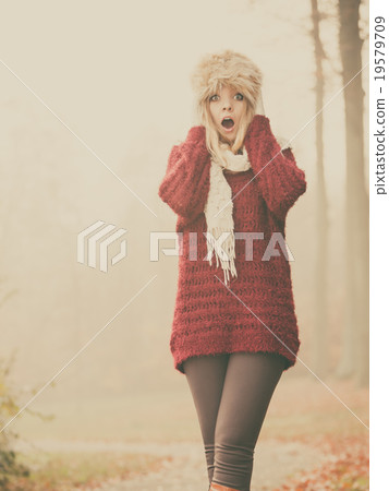 Pretty amazed fashion woman in fur winter hat. Pretty amazed fashion woman in fur winter hat. 19579709