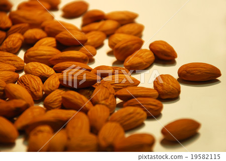 Peeled kernel almonds in bulk close up in bulk as 19582115