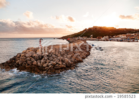 Entrance in bay with lighthouse, Gozo, Malta. 19585523