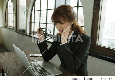 A woman working 19588432