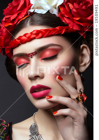 Beautiful girl with red lips and flowers 19589491