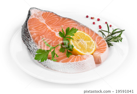 Raw salmon steak with lemon. Raw salmon steak with lemon. 19591041