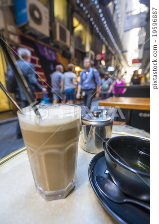 Enjoying coffee and tea in a laneway Enjoying coffee and tea in a laneway 19596887
