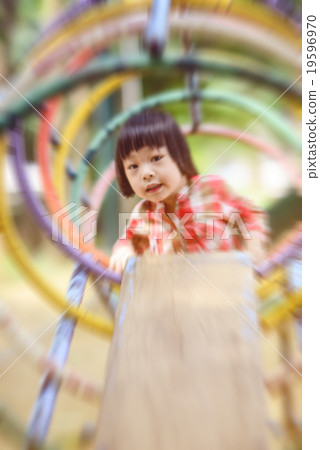 Motion blur Asian little kid playing in the park 19596970