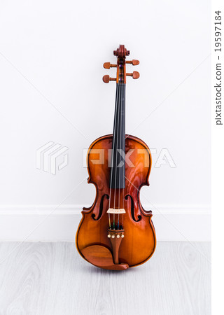 Classical cello on white wall background Classical cello on white wall background 19597184