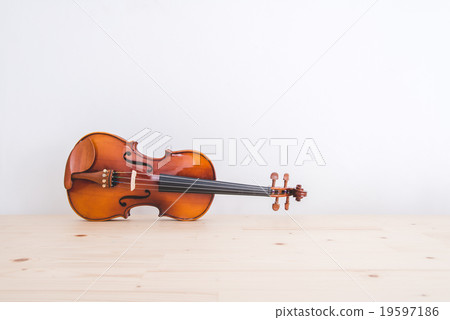 violin on pine wood table with copyspace. 19597186