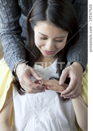 A woman receiving a ring 19597926