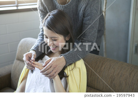 A woman receiving a ring 19597943