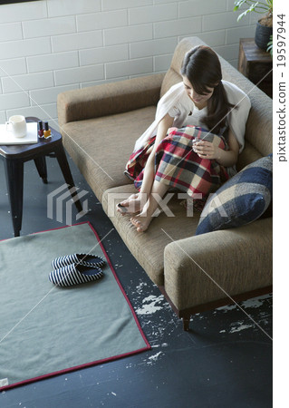 Women in their twenties who paint nail polish Women in their twenties who paint nail polish 19597944