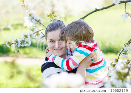 Young mother and little kid boy having fun in Young mother and little kid boy having fun in 19602159