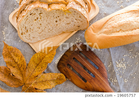 Loaf of sliced bread on wooden background Loaf of sliced bread on wooden background 19605757