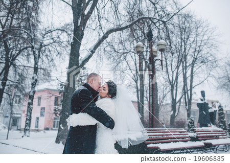 Bride and groom walking on the city Bride and groom walking on the city 19606885