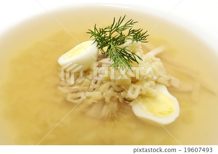 broth with pasta greens and quail egg in a white p broth with pasta greens and quail egg in a white p 19607493